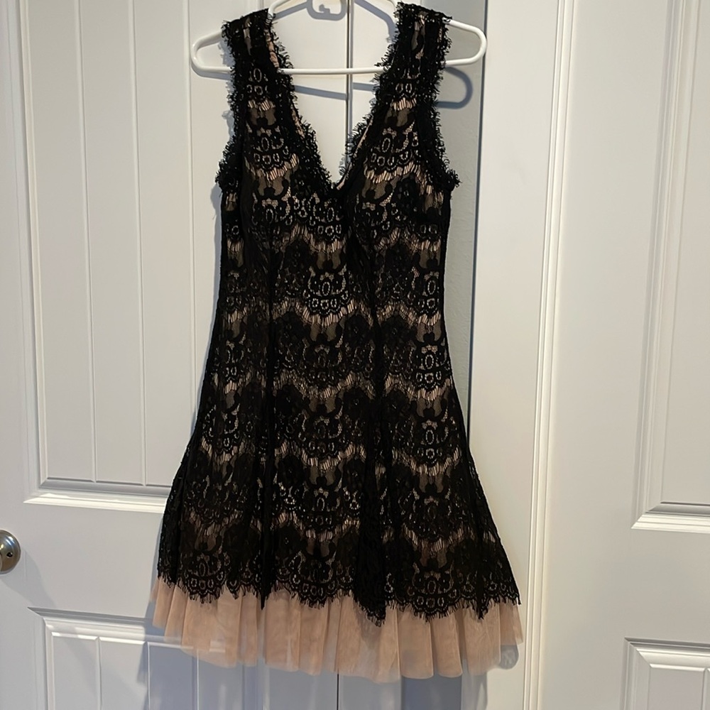 Formal lace and tulle black dress. V neck, v back with zip closure.